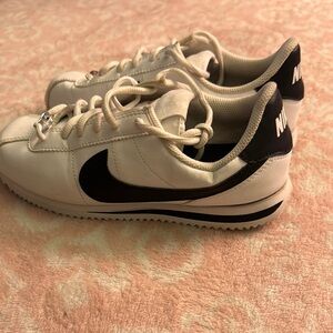 Nike White Sneakers with Black Swoosh